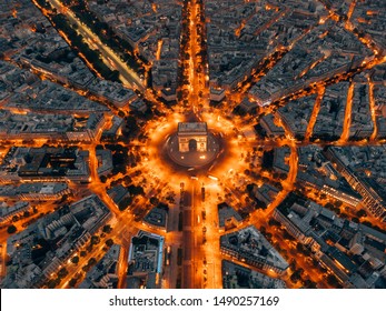 Paris at night with the Arc de Triomphe in the centre
