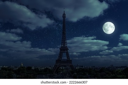 Paris at night during energy crisis, France. Full blackout of city due to expensive gas and electricity in Europe. View of Eiffel Tower and moon on dark sky. Concept of EU economy, sanctions, saving. - Powered by Shutterstock