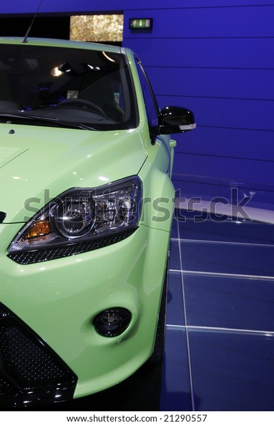 PARIS - OCTOBER 13 : People\
look at the Ford Focus RS at the 2008 Paris Motor Show October 13,\
2008 in Paris. The show attracts more of one million people every 2\
years