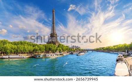 Paris panorama with Eiffel Tower and River Seine at sunset, France.
