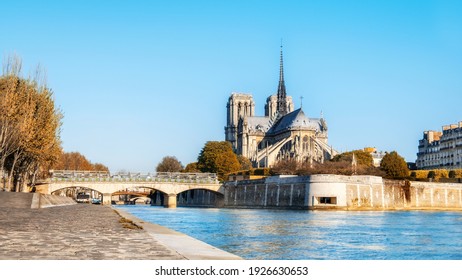 Paris, panorama over river with Notre-Dame Cathedral on a bright day in Autumn. This image is tinted.