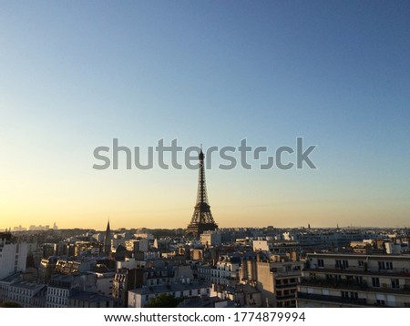 Paris skyline with an impressive Eiffel Tower in the sunrise.