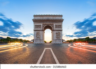 Paris street at night with the Arc de Triomphe in Paris, France. - Shutterstock ID 315886463