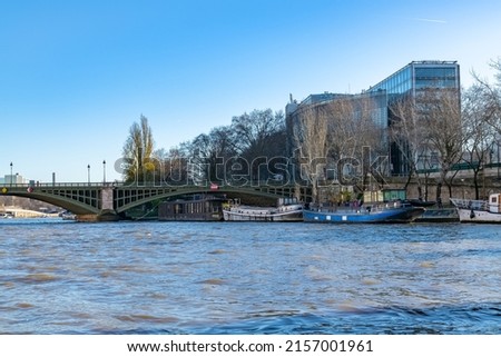 Paris, the Sully bridge on the Seine, and the Institut du monde arabe in background Stock fotó © 