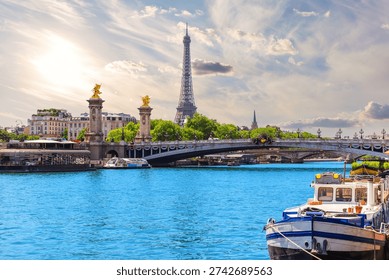 Paris sunset view with Eiffel Tower and Alexandre III Bridge over river Seine, France