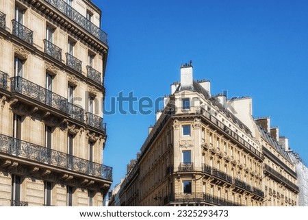 Paris traditional apartment complex with Parisian style balconies and rooftop in Paris, France