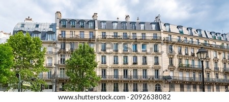 Paris, typical facades and street, beautiful buildings rue du Temple