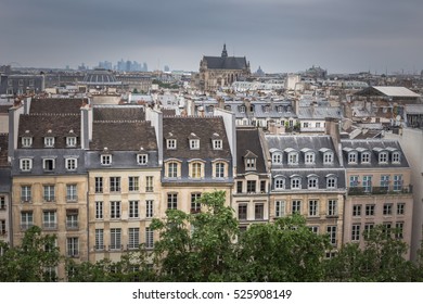 Paris view of historical apartment buildings and Paroisse Saint-Eustache cathedral or the Church of Saint Eustache. View from the top of The Centre Pompidou modern art museum.
