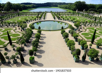 Paris-August 05 2014: Gardens Of Versailles-Ideal Of French Baroque Garden Architecture, Art And Landscaping With A Geometrical Concept Of Beds, Bushes, Flowers, Gravel Planes, Fountains, Sculptures