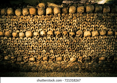 Paris/France - 9/18/2013: A final resting place for over six million Parisians. Piles of skulls and bones organized in this underground space.
