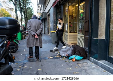 Paris/France - November 11,2018;  An Old Homeless Woman Sleeping Right Next To A Grocery Store In Paris.