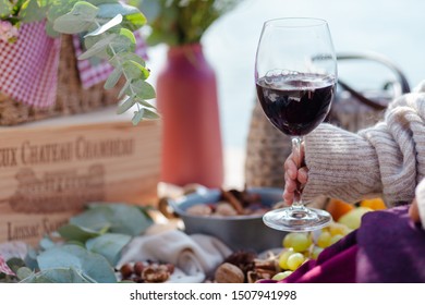 Paris/France - September 08 2019: Romantic Picnic For Two On The Quay Of Seine River. Parisien Elegancy And Chic. Cheese, Fruits, Rustic Decor. Young Girl Holding Glass Of French Red Wine In Her Hand