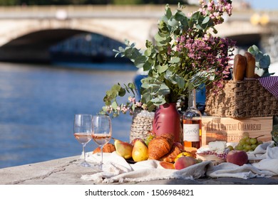 Paris/France - September 8 2019: Romantic Picnic For Two On The Quay Of Seine River In Paris. Parisien Elegancy And Chic. Traditional French Croissants, Cheese, Fruits And French Wine. 