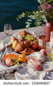 Paris/France - September 8 2019: Romantic Picnic For Two On The Quay Of Seine River In Paris. Parisien Elegancy And Chic. Traditional French Croissants, Cheese, Fruits And French Wine. 