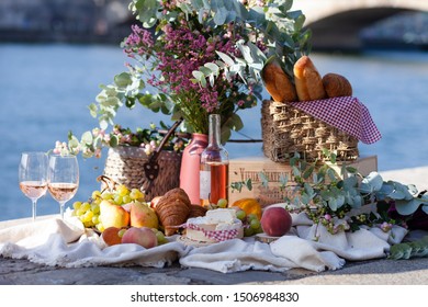 Paris/France - September 8 2019: Romantic Picnic For Two On The Quay Of Seine River In Paris. Parisien Elegancy And Chic. Traditional French Croissants, Cheese, Fruits And French Wine. 