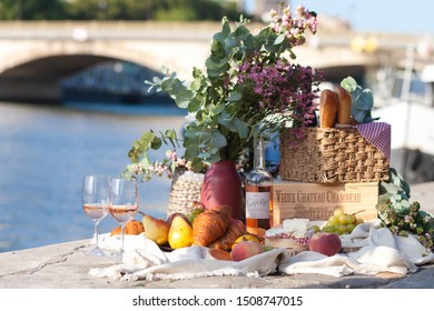 Paris/France - September 8 2019: Romantic Picnic For Two On The Quay Of Seine River In Paris. Parisien Elegancy And Chic. Traditional French Croissants, Cheese, Fruit And French Wine