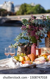 Paris/France - September 8 2019: Romantic Picnic For Two On The Quay Of Seine River In Paris. Parisien Elegancy And Chic. Traditional French Croissants, Cheese, Fruit And French Wine