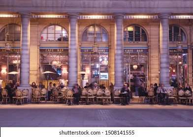 PARIS,FRANCE-NOV.18,2009: People Sit And Drink A Coffee Outside Le Cafe Nemours,  Just Outside The Beaded Entrance Of Métro Palais Royal, A Parisian Café Where Angelina Jolie Filmed 