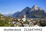 Parish Church of St. Anthony at the st. Gallen town Wangs with Sargans, Mont Gonzen and the Churfirst mountain range at the background. The town is the starting point for Pizol trekking trails.