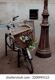 Parisian Bicycle With A Basket Case And Flowers