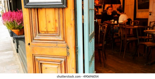 Parisian cafe. Blurred interior with young couple. Romantic Paris concept. - Powered by Shutterstock