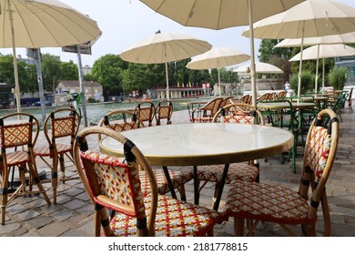 Parisian Cafe Terrace On Canal Riverbank