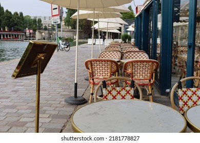 Parisian Cafe Terrace On Canal Riverbank