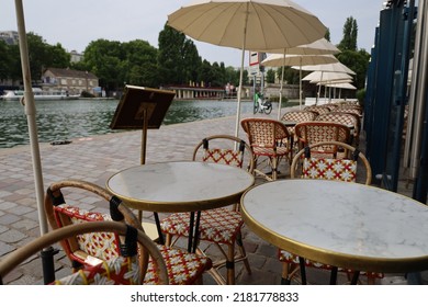 Parisian Cafe Terrace On Canal Riverbank