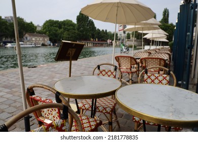 Parisian Cafe Terrace On Canal Riverbank