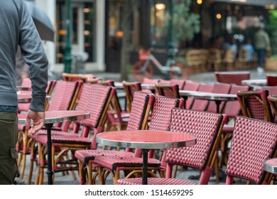 Parisian Café Terrace With Red Rattan Furniture A Rainy Day