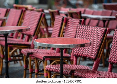 Parisian Café Terrace With Red Rattan Furniture A Rainy Day