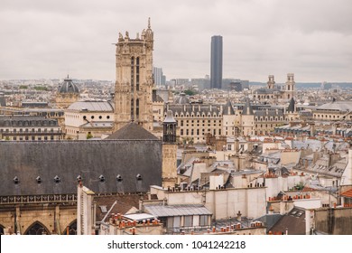 Parisian urban landscape with a fountain Pompidou, the Church of Saint-Merri, Notre-Dame Cathedral and the Tower of Saint-Jacques.
