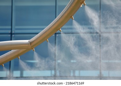 park air freshener with micro drip sprayer made of stainless steel in public park in hot summer will relieve runners who will refresh  here. children have fun here run through water, infection, yard - Shutterstock ID 2186471169