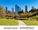 Park alley in Houston downtown at sunny autumn day in Eleanor Tinsley Park, Houston, Texas, USA.