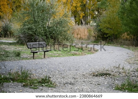 Park Bench in Arrowhead Park Utah with winding Trail