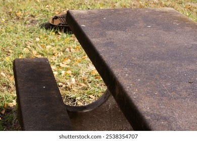 Park bench in grass area. - Powered by Shutterstock