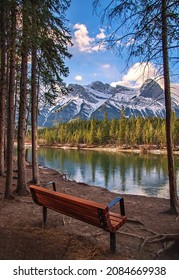 Park Bench Looking Out Over Canmore Mountains And River