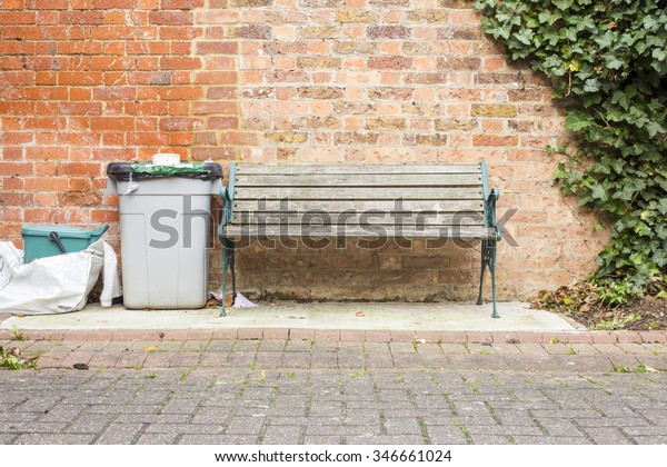 Park Bench Over Brick Wall Rubbish Stock Image Download Now