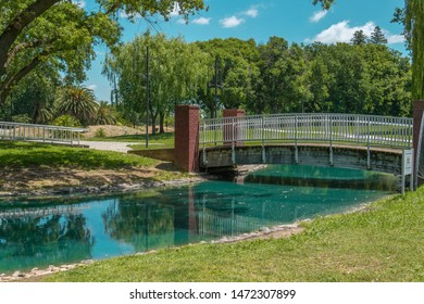 Park bridge over man-made river - Shutterstock ID 1472307899