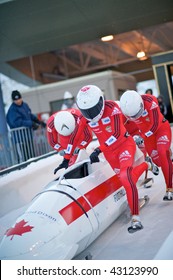 PARK CITY - DECEMBER 5: Team Canada Pushes Off At The Start Of Their Race In The  America's Cup Bobsled Races December 5, 2009 In Park City, Utah.