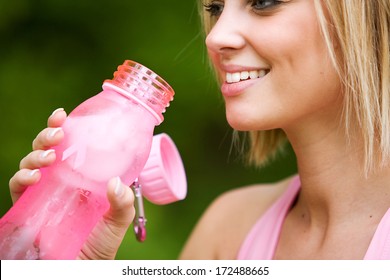 Park: Girl Taking A Drink From Pink Water Bottle