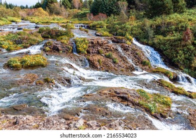 Park Kermoafoss Waterfall With Forest And Tree View Near Reykjavik, Iceland In Autumn Time