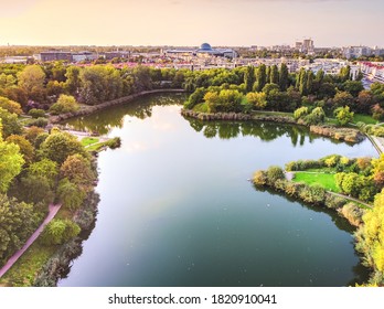 Park with large lake in the big, capital city. Drone, aerial view