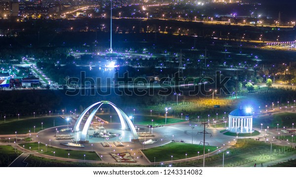 Park named after the First President\
of the Republic of Kazakhstan in the city of Aktobe night\
timelapse. Aerial top view from above. Western\
Kazakhstan.