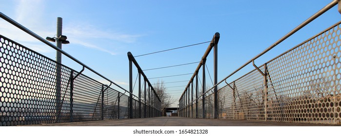 In A Park Near Barcelona There Is A Small Steel Bridge ....