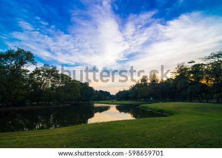 Park with pond sunset colourful sky, Natural public park