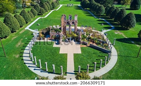Park showcasing old ruins surrounded by stone pillars and walkway