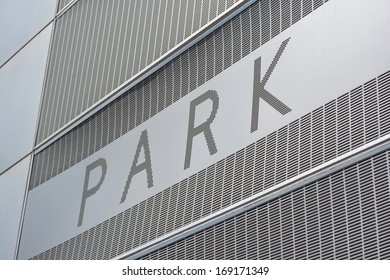 Park Sign On The Exterior Of A Public Parking Garage.