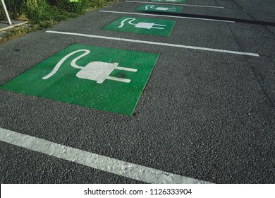Park Space for Electric cars. Electric Vehicle designated parking spot - Shutterstock ID 1126333904