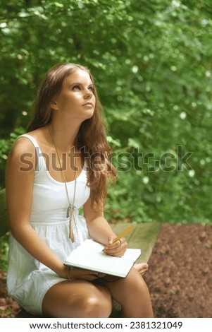 Park, thinking and a woman writing in a journal outdoor during summer for mental health or expression. Creative, diary and peace with a young person in a green garden to relax for wellness or freedom